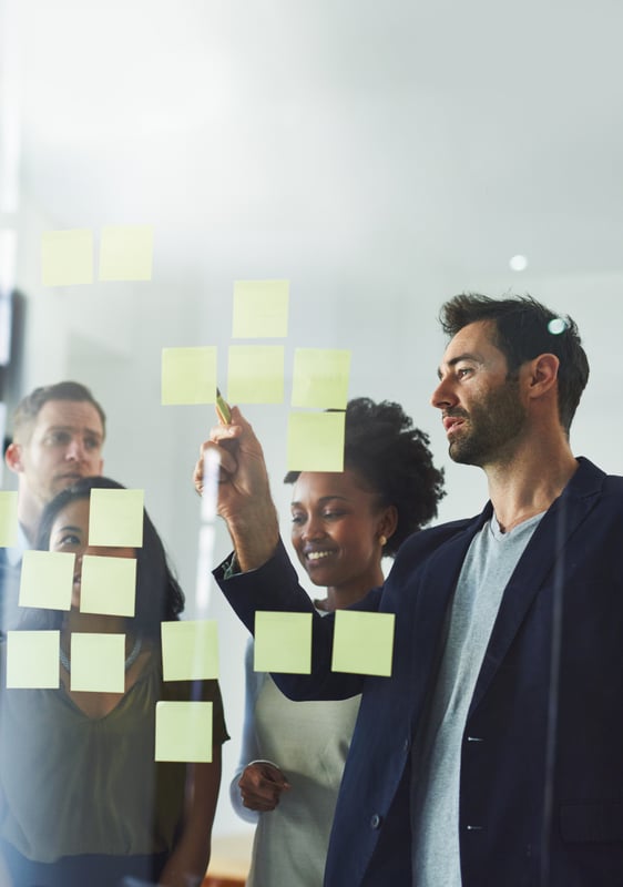 idea-writing-business-people-meeting-planning-discussion-brainstorming-office-creative-startup-workers-with-sticky-notes-glass-wall-teamwork-research-project