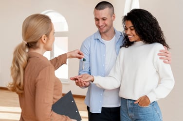 realtor-handing-smiley-couple-keys-their-new-home